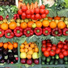 Fresh vegetables and fruit arranged at an agricultural market